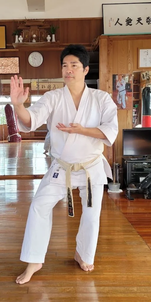 Karateka in an open-hand guard stance