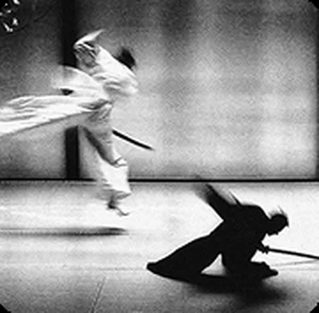 Two karateka in a kobudo weapons duel